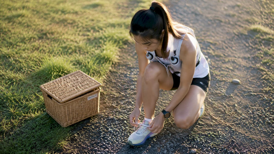 Female runner preparing for run outdoors