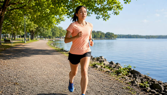 Woman running monitoring heart rate during marathon training