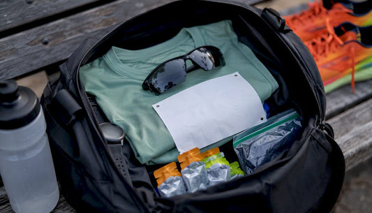 Overhead view of race day essentials packed in running bag