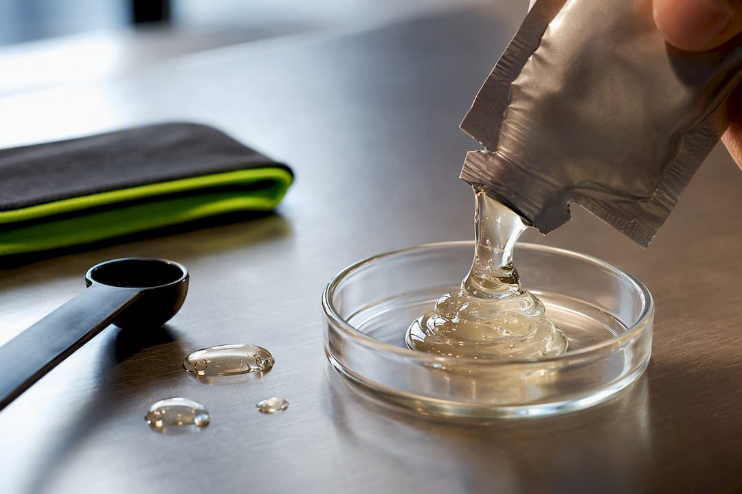 Anonymous energy gel revealing glossy carbohydrate texture