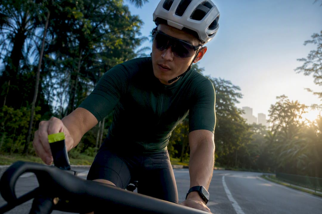 Cyclist taking fuel during endurance ride