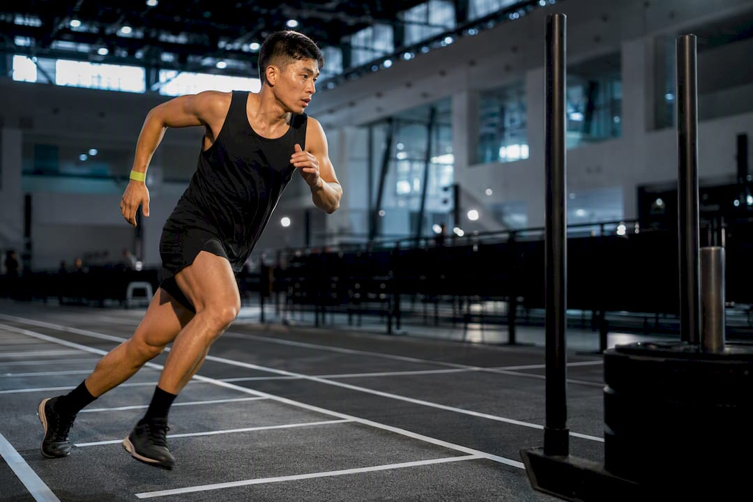 HYROX athlete transitioning between race stations
