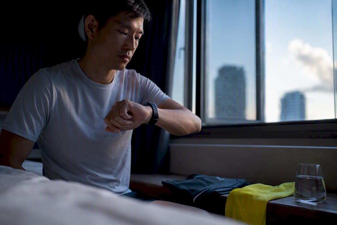 Runner checking morning training readiness