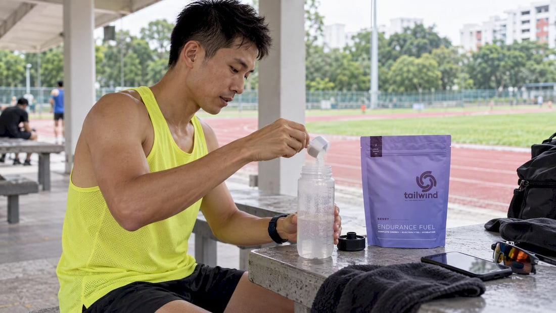 Runner mixing Tailwind fuel before training