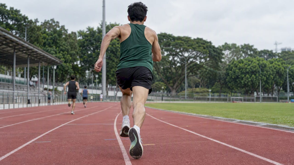Runner accelerating through a track finishing sprint