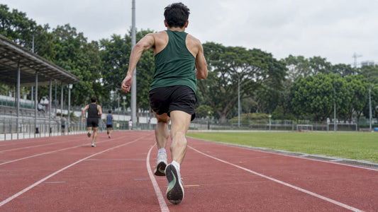 Runner accelerating through a track finishing sprint