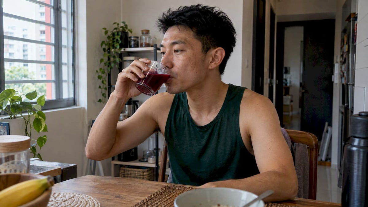 Runner drinking beetroot juice before training