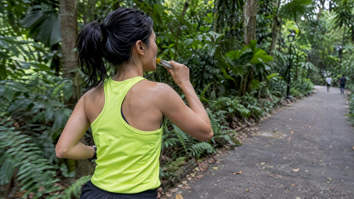 Runner taking an energy gel in Singapore