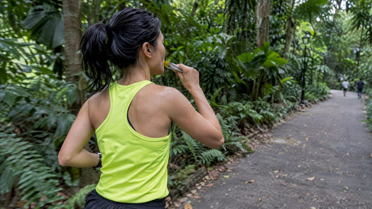 Runner taking an energy gel in Singapore