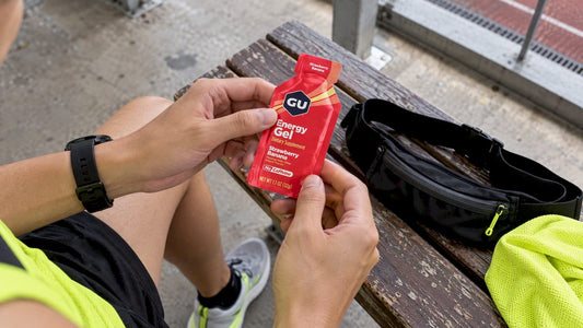 Runner preparing a non-caffeinated energy gel