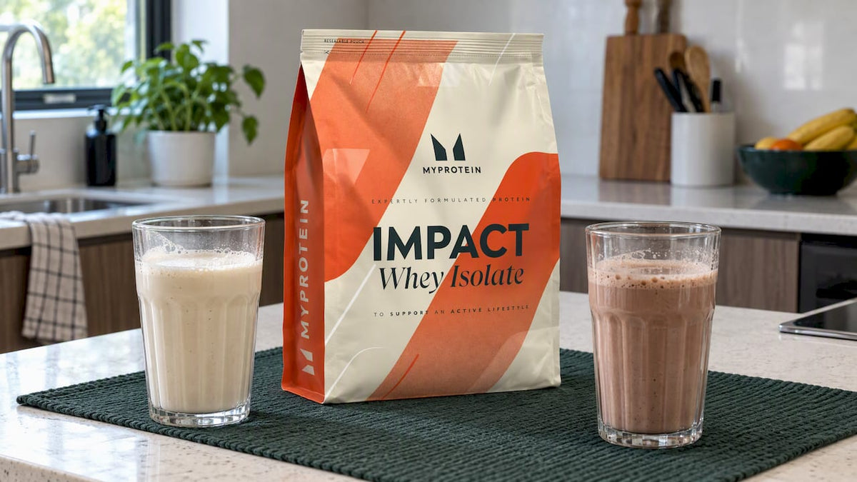 Whey isolate tub beside prepared protein servings