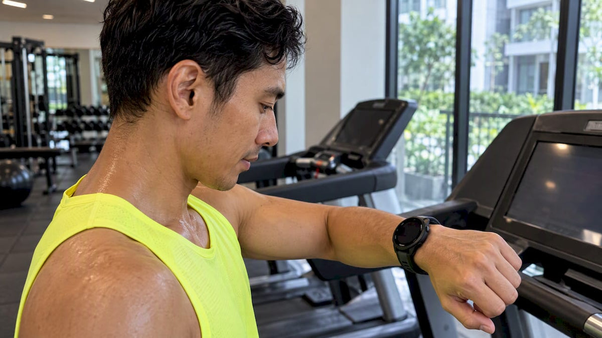 Runner checks a Garmin watch after training
