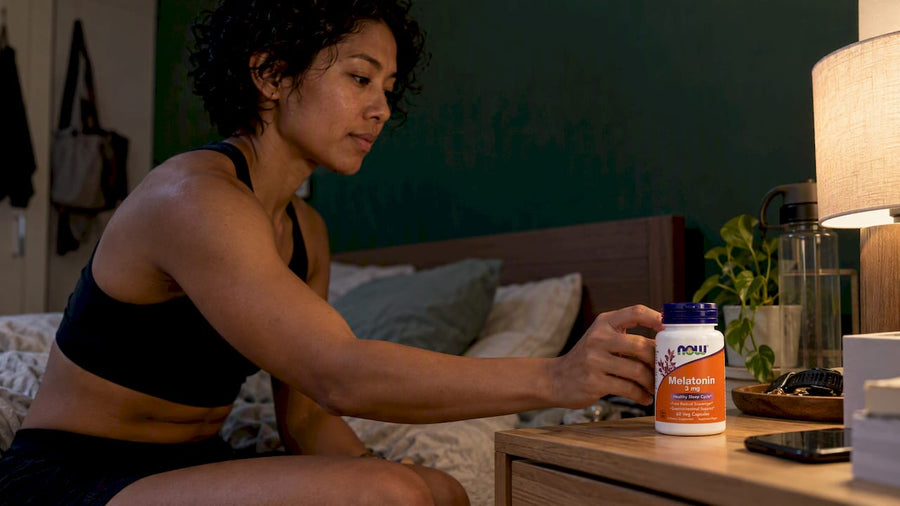 Athlete placing melatonin beside her bed