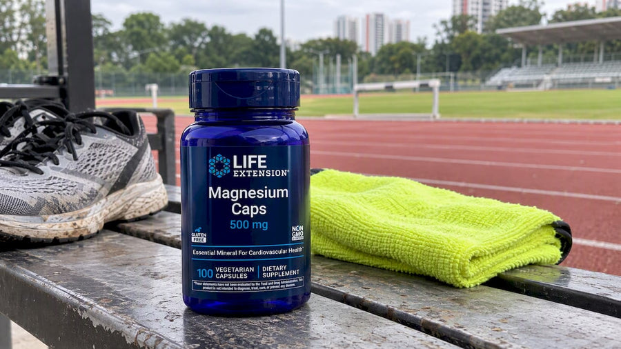 Magnesium supplement beside running shoes at a track