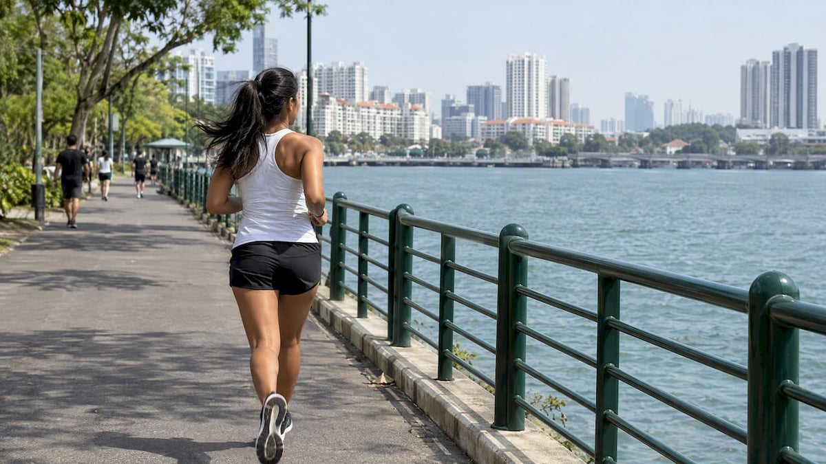 Runner jogging beside Singapore waterfront
